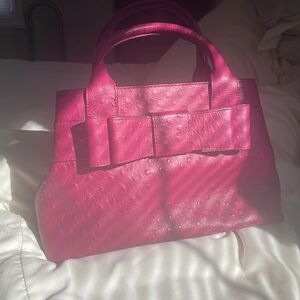 Kate Spade Charm City Ostrich purse.  Color is Red Plum